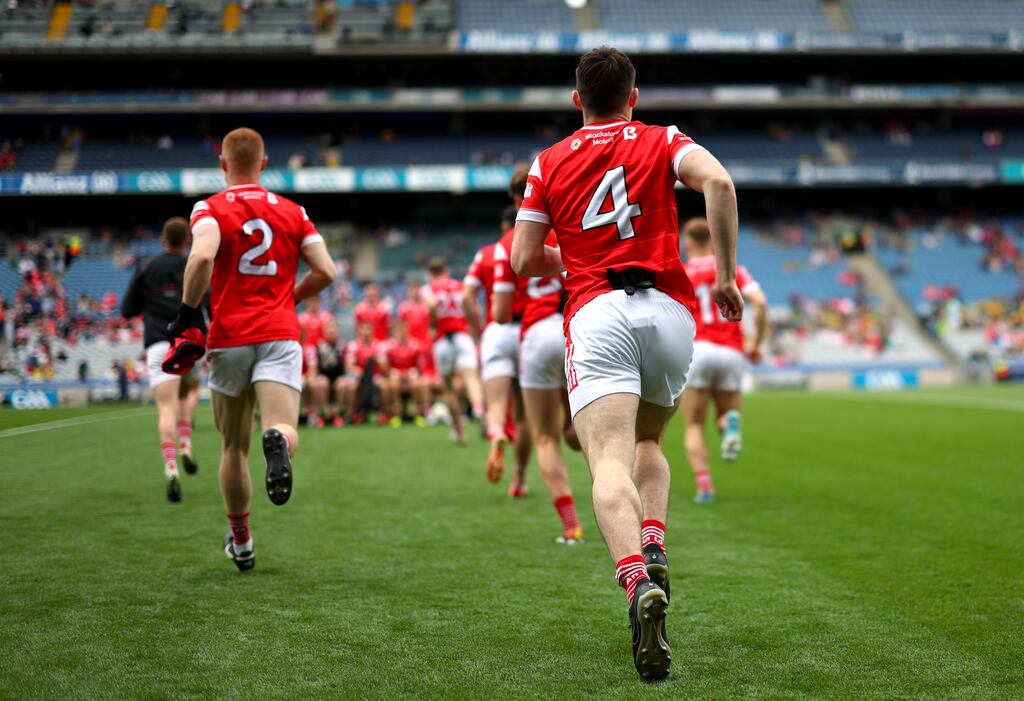 Louth footballers take to the field at Croke Park last summer. The report finds years of service at intercounty level can take its toll on players' mental health. Photograph: James Crombie/Inpho