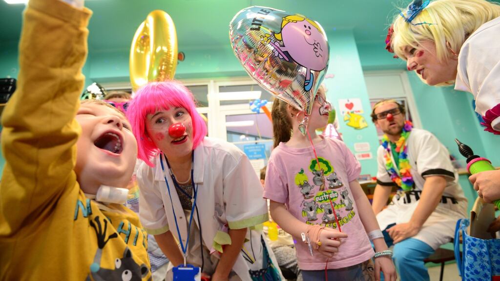 Patients Phillip Rzymske and Eva Troy with clown doctors Dr Razzmatazz, Dr Coolio and Dr Ditzy Glitzy at the 60th-birthday celebrations of Our Lady’s Children’s Hospital in Crumlin, Dublin. Photograph: Dara Mac Dónaill