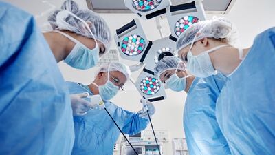 Team of nurses and surgeons in surgery. Photograph: Stockvisual/Getty