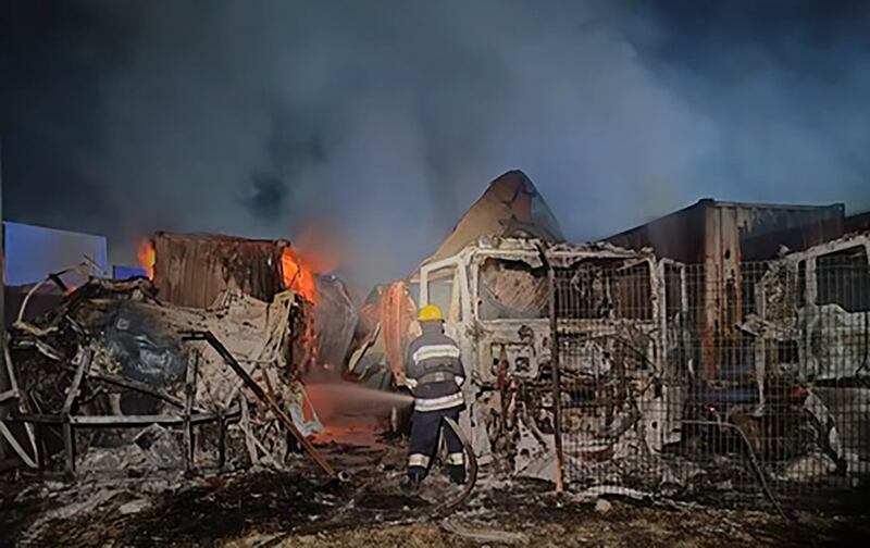 Firefighters work to extinguish a fire in port infrastructure after a Russian rocket attack in Izmail, Odesa region. Photograph: Odesa Region Administration via AP/PA