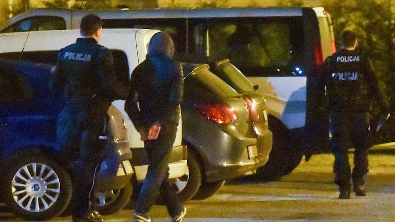 One of the suspects (C) detainded by the police after the incident at the Auschwitz Museum in Oswiecim, Poland. Photograph: EPA