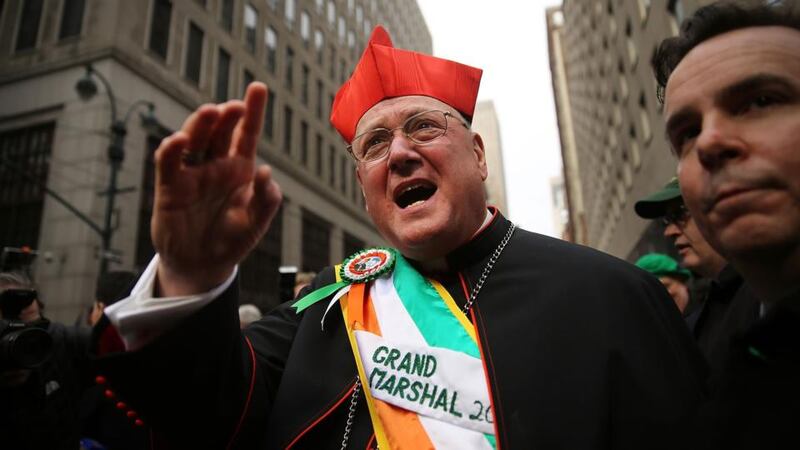 New York St Patrick’s Day parade grand marshall, Cardinal Timothy Dolan, makes his way up Fifth Avenue during the city’s parade.  Photograph: Spencer Platt/Getty Images