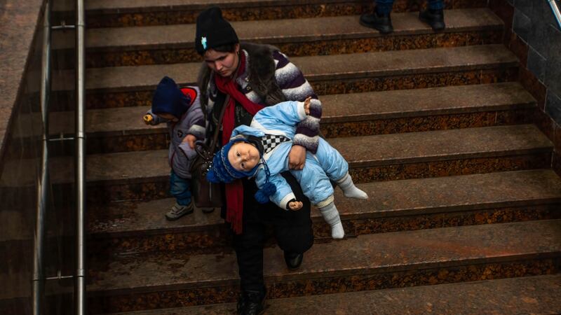 A mother holds her children after arriving in Lviv from Mariupol. Photograph: Ty O’Neil/SOPA Images/LightRocket via Getty Images