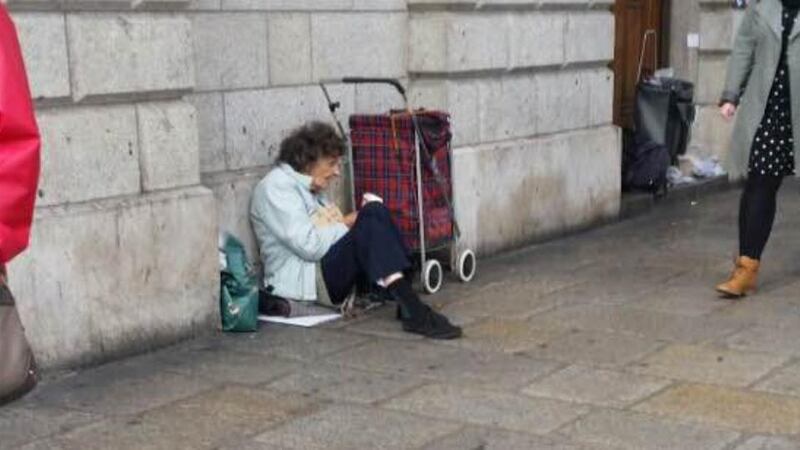 Karen Smith from Drogheda was on her way to a protest in central Dublin last Saturday when she passed a woman sitting on the pavement outside the Bank of Ireland on College Green. Photograph: Karen Smith