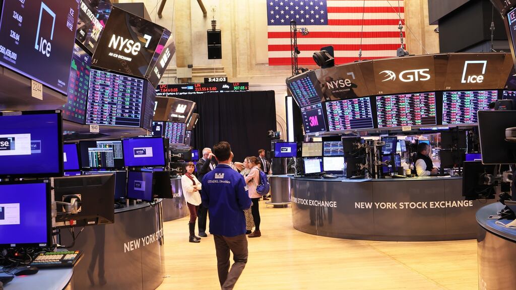 Traders work on the floor of the New York Stock Exchange. US stocks rose on Tuesday even in the face of surging Treasury yields as a positive earnings reports helped investors shrug off potential risks from an aggressive rise in US interest rates and the Ukraine war.