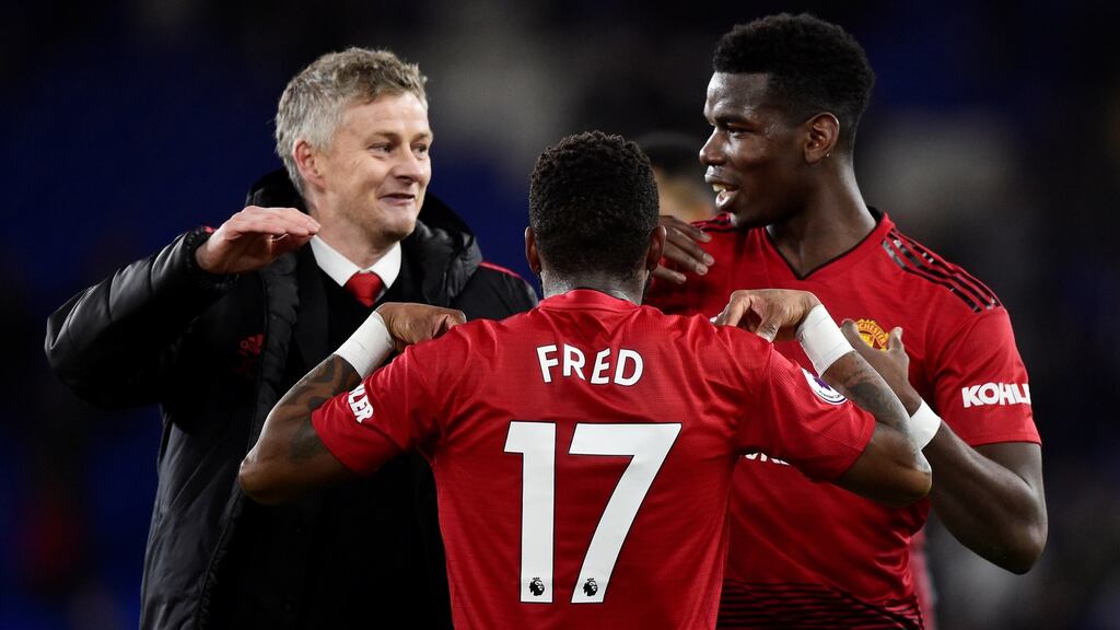 Manchester United’s Paul Pogba and Fred celebrate after beating Cardiff with interim manager Ole Gunnar Solskjaer. Photograph: Reuters