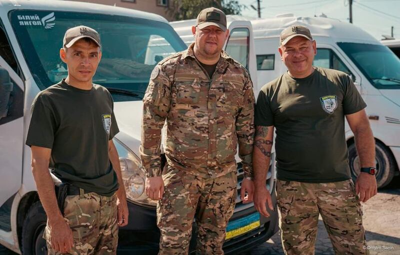 Police officers Vasyl Pipa, Artem Shus and Rustam Lukumskiy are part of a team dubbed the 'White Angels' that evacuates civilians from frontline towns and villages. Photograph courtesy of Vasyl Pipa