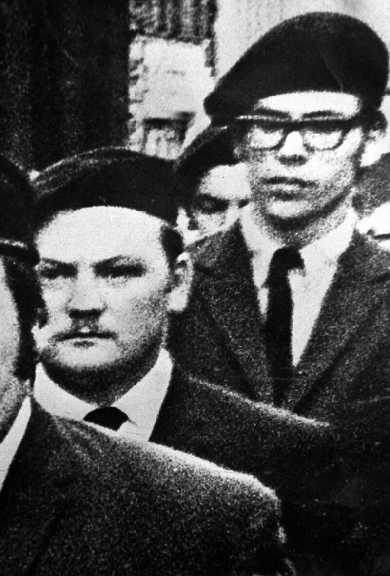 Gerry Adams (right) and Martin Meehan (centre) in a guard of honour at the funeral of an IRA leader in 1971. Photograph: Justin Kernoghan / Photopress Belfast