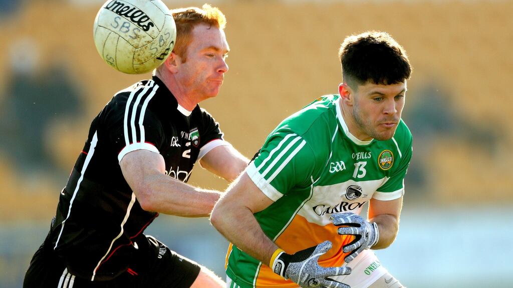 Where’s the ball? Sligo’s Ross Donavan and Bernard Allen of Offaly in action. Photograph: James Crombie/Inpho