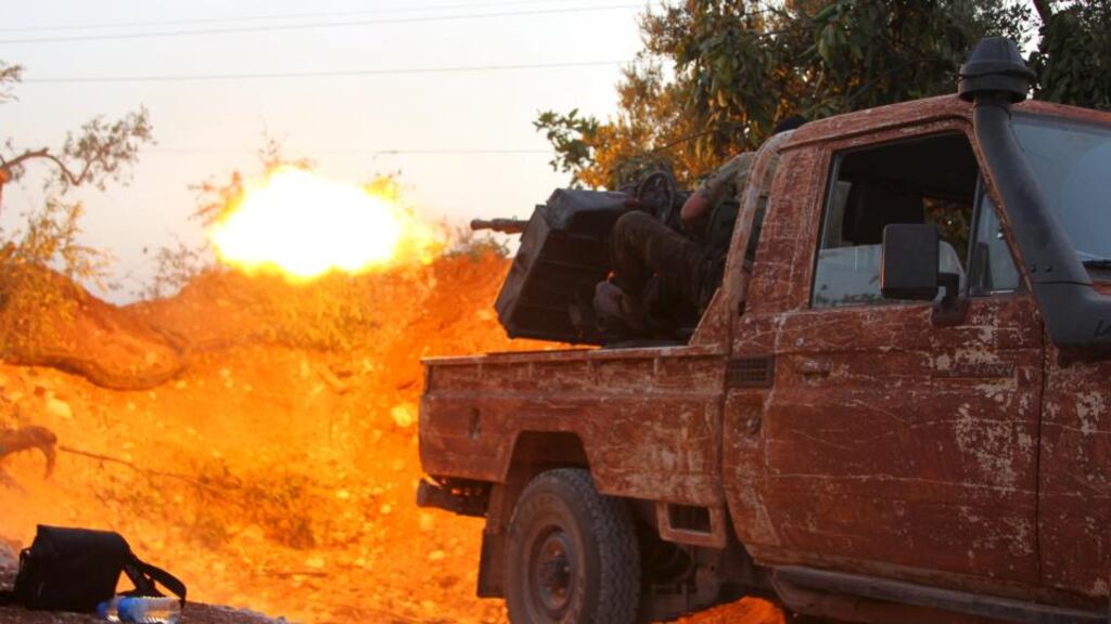 Members of al-Qaeda’s Nusra Front fire their weapon during an offensive to take control of the northwestern city of Ariha in Idlib province. Photograph: Reuters/Ammar Abdullah