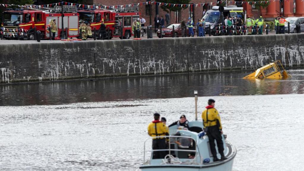 Emergency services on the scene as an amphibious tour bus sank in Liverpool’s Albert Dock. Photograph: Peter Byrne/PA Wire
