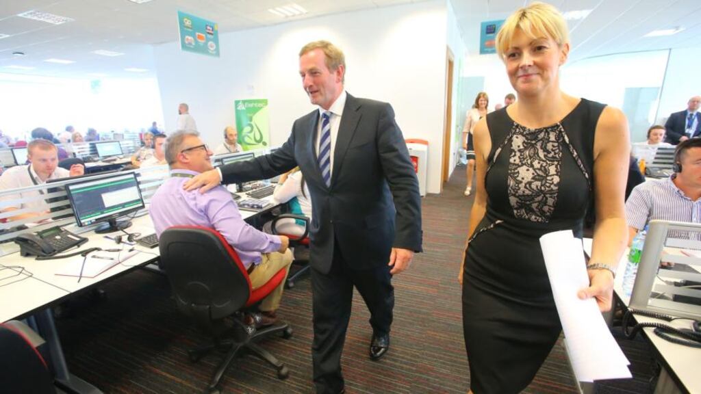 Taoiseach Enda Kenny with Heather Reynolds, co-founder of Eishtec in Waterford city where JobsPlus was announced yesterday. Photograph: Patrick Browne