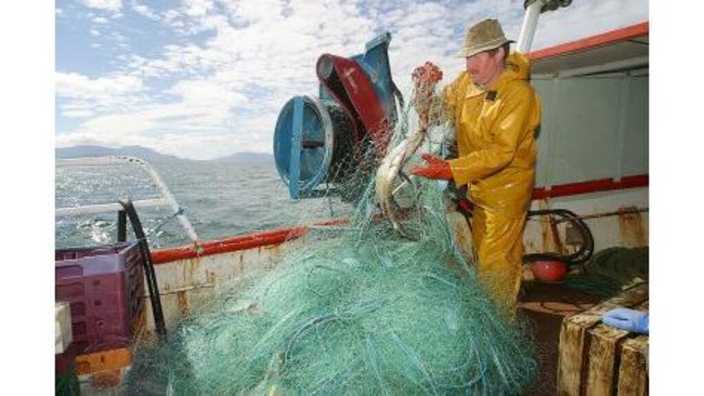 A fisherman at work on a trawler near Inishturk island, off the Mayo coast