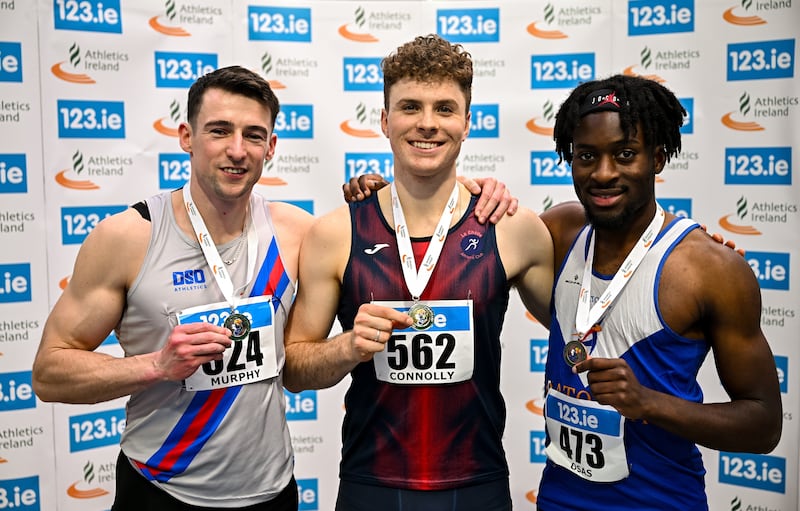 Murphy (left), of Dundrum South Dublin AC, shows his men's high jump silver medal at the National Senior Indoor Championships in February, with Ciaran Connolly of Le Chéile AC, Kildare, (gold), and Emmanuel Osas of Ratoath AC (bronze). Photograph: Sam Barnes/Sportsfile
