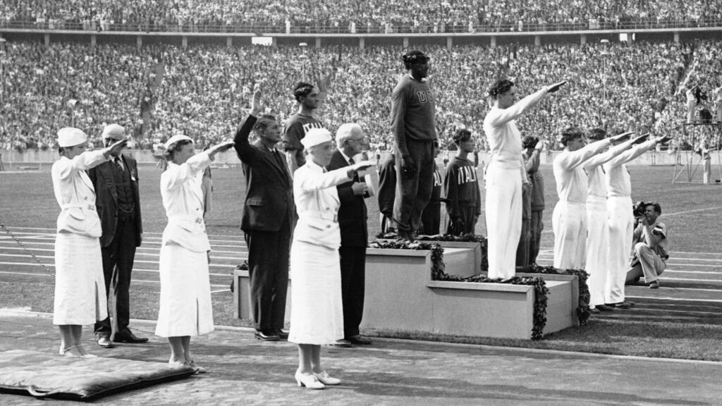 Jesse Owens at the medal presentation during the 1936 Olympics in Berlin. Photo: Getty Images