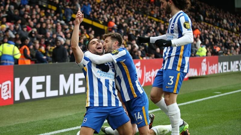 Neal Maupay celebrates with teammates Adam Lallana and Marc Cucurella.. Photograph: Steve Bardens/Getty Images
