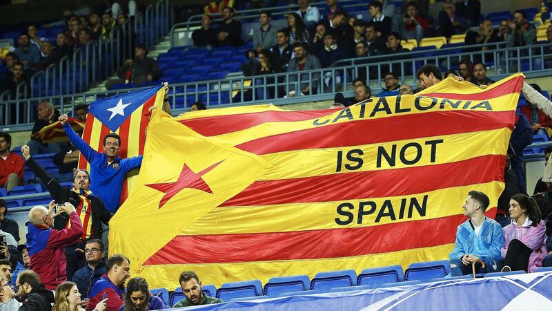 Barcelona fans show a Catalan independence flag during their win over Olympiacos. Photo: Alejandro Garcia/EPA
