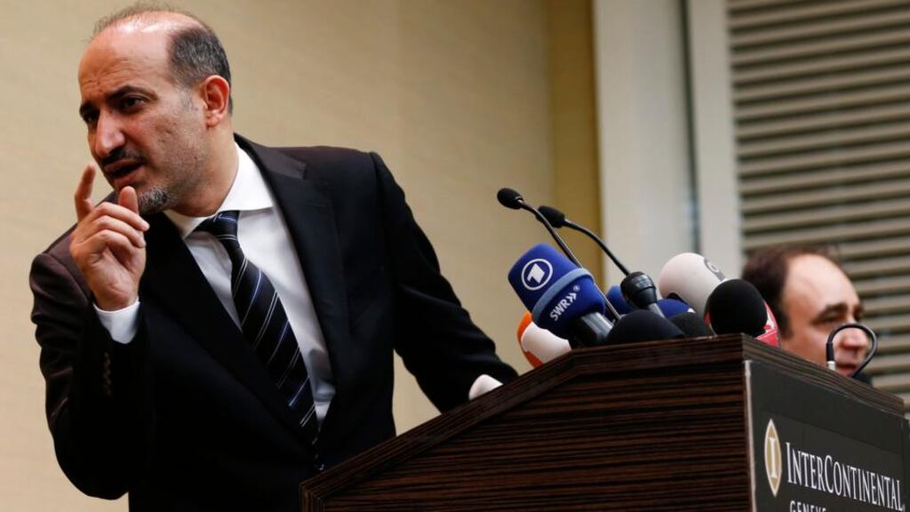 Syrian opposition leader Ahmed Jarba answers questions during a news conference in Geneva on Thursday. Photograph: Reuters