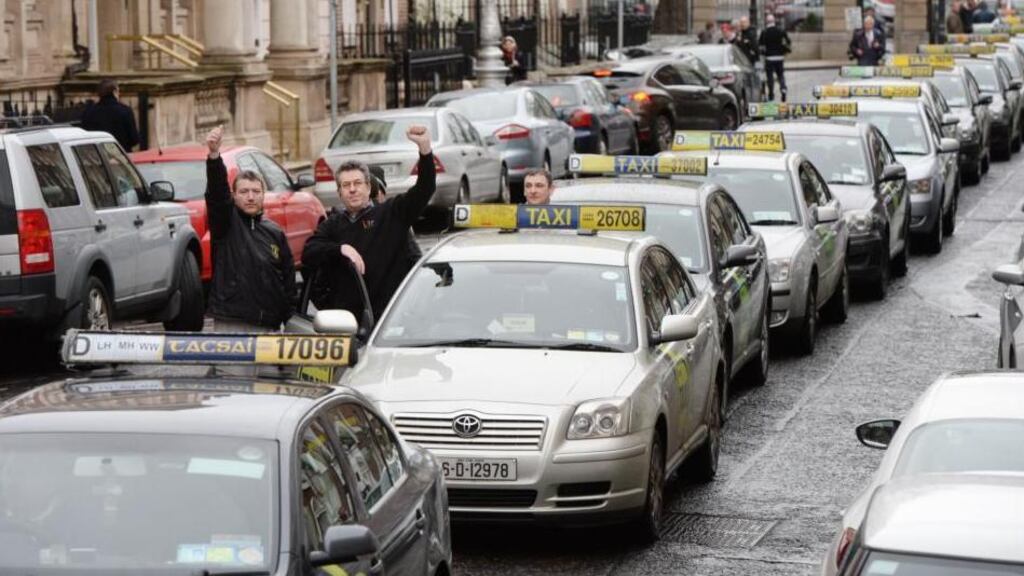 The ESRI said the current cap on new taxi licences was not justified and would lead to the lengthening queues and longer waiting times for consumers. Photograph: Alan Betson