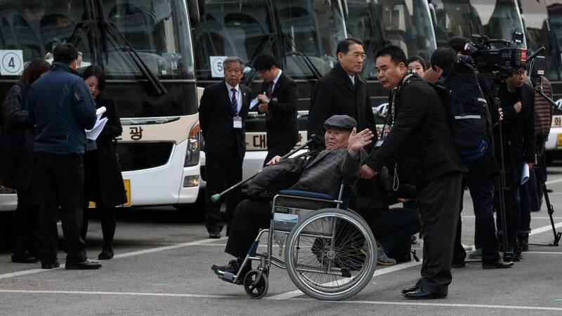 South Korean Jang Chun (82) waves as he leaves for North Korea’s Mount Kumgang resort to meet his family members. Photograph:  Yonhapp/EPA.