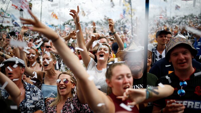 Revellers  during the Glastonbury Festival on Sunday. In 2017, the last time the event was held, more than 1 million single-use plastic bottles were sold on the site.  Photograph: Henry Nicholls/Reuters