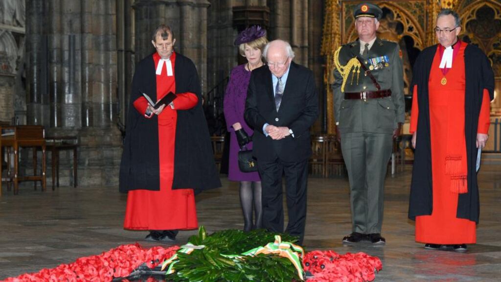 President Michael D Higgins, with his wife Sabina Coyne, at the grave of the Unknown Warrior in Westminster Abbey. Photograph: Anthony Harvey/Getty Images