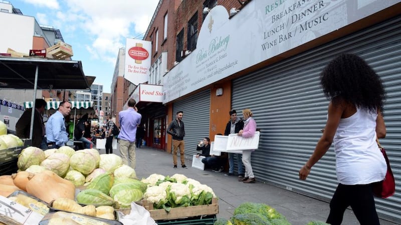 Staff of the Paris Bakery in Moore Street, Dublin outside the premises on Wednesday. Photograph: Dave Meehan/The Irish Times