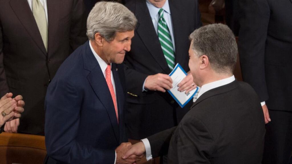 US secretary of state John Kerry (left) shakes hands with Ukrainian president Petro Poroshenko at a joint meeting of Congress on Capitol Hill in Washington today. Photograph: Michael Reynolds/EPA