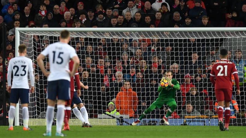 Loris Karious saves Harry Kane’s first penalty at Anfield. Photograph: Michael Regan/Getty