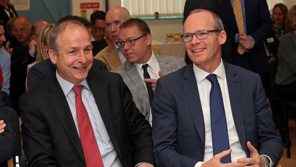 Fianna Fáil leader Micheál Martin with his constituency colleague and Fine Gael leadership contestant Simon Coveney in Cork on Monday. Photograph: Jim Coughlan.
