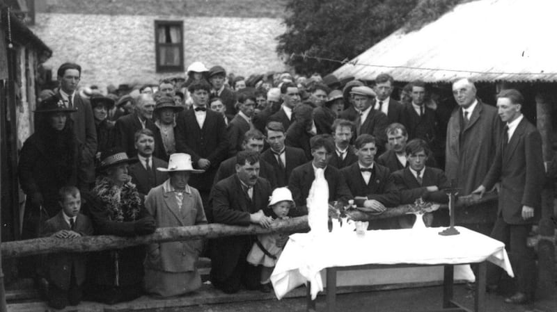 Pilgrims praying in Dwan’s Yard, August 1920. Photograph: RTÉ Stills Library