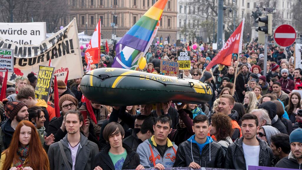 Thousands of people gather in front of the Parliament at the ‘Refugees Welcome! No to Fortress Europe!’ rally in Vienna, Austria. People protested around the world as part of the UN anti-racism day, for greater rights for migrants and refugees. Photograph: Joe Klamar/AFP/Getty Images