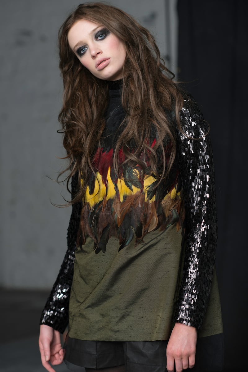 Autumn sunset feather dress €800, nigh rain sequin turtleneck €300, khaki shorts €50, fishing hat €250