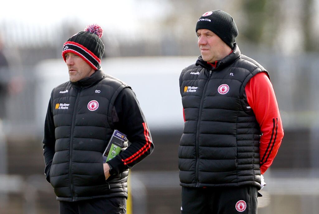 Brian Dooher and Feargal Logan: will continue to guide Tyrone's senior footballers until the end of 2026 after being handed a new three-year mandate. Photograph: James Crombie/Inpho