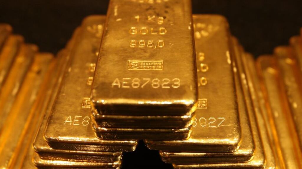 One-kilo gold bars on display. Gold for immediate delivery climbed for a fifth day, the longest run since May, and increased as much as 1 per cent to $1,120.02 an ounce. Photograph: Reuters.