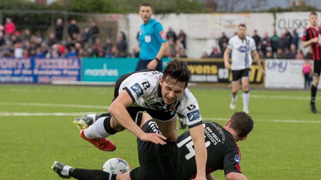 Dundalk’s Jamie McGrath is tackled by Paddy Kavanagh of Bohemians. Photo: Morgan Treacy/Inpho
