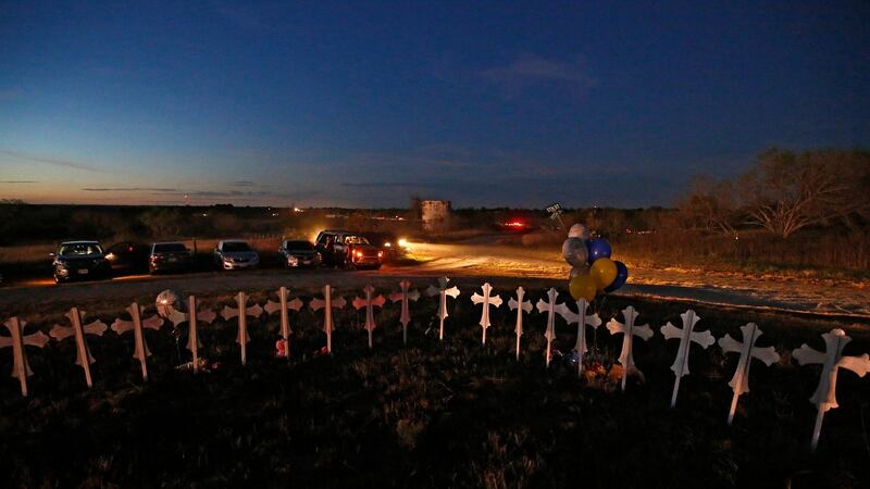 Twenty-six crosses stand on a field representing the victims of the shooting in Sutherland Springs, Texas. Photograph: Larry Smith/EPA