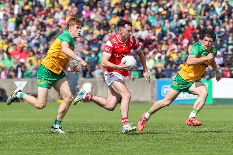 Louth's Craig Lennon in action against Donegal's Ciarán Moore and Finnbarr Roarty. Photograph: Lorcan Doherty/Inpho