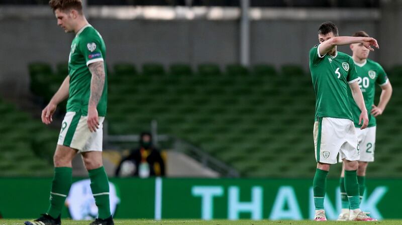 James Collins, Jason Knight and Dara O’Shea dejected at the end of the gam. Photo: Tommy Dickson/Inpho
