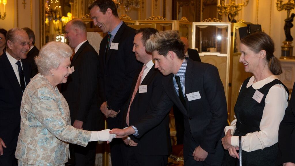 One Direction’s Niall Horan (2nd right) meets Queen Elizabeth of Britain at a reception for the Irish community at Buckingham Palace, London. Photograph: Steve Parsons/PA Wire