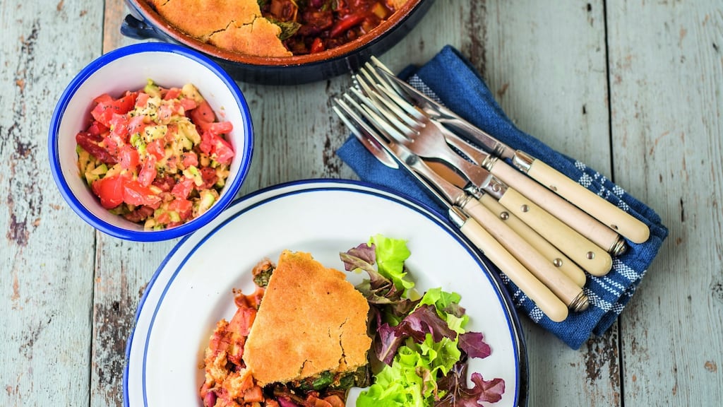Cover the chilli with the spinach leaves. Top it off with the cornbread dough, then put into the preheated oven
