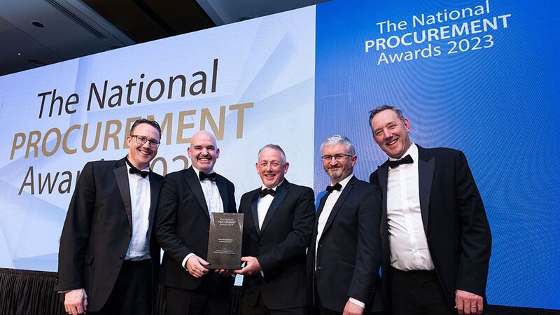 Robert Babington, awards judge, presents the overall excellence in procurement award to Musgrave team