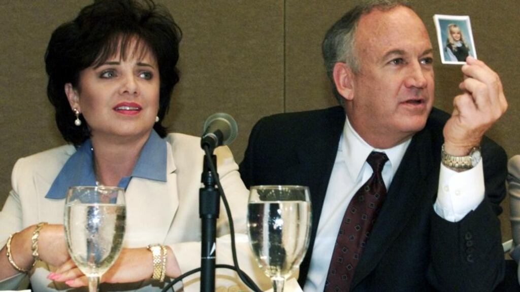Patsy Ramsey and her husband, John Ramsey, produce a picture of JonBenet Ramsey during a press conference where they released the results of an independant lie detector test in Atlanta in 2000. Photograph: Tami Chappell/ Files/Reuters