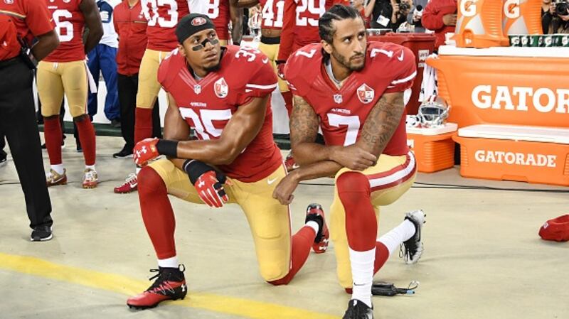 Colin Kaepernick and Eric Reid then of the San Francisco 49ers kneel in protest during the national anthem prior to playing the Los Angeles Rams in their NFL game in 2016. Photograph: Getty Images