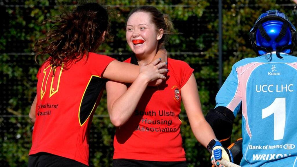 Lurgan’s Kerrie Burns congratulates goalscorer Sara McClure in the Irish Hockey League Women’s Pool A game against UCC at the weekend. Photograph: Rowland White/Inpho