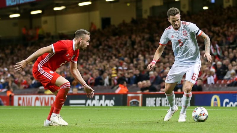 Saul Niguez of Spain in action against Chris Gunter of Wales during the friendly at the Principality stadium in Cardiff. Photograph: Mike Griffiths/EPA