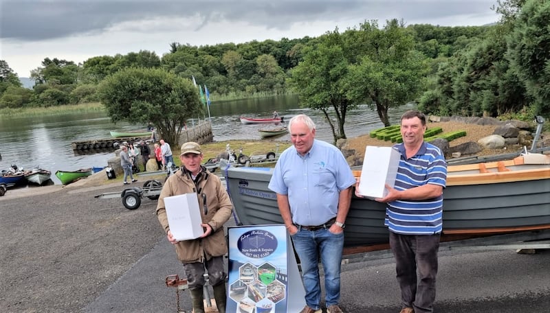 Winners of the Lough Melvin Championships Sean Maguire (left) and Edwin Wills (right), who each received a 19ft Foley boat and Galway Crystal, with club chairman, Terry McGovern (centre).
