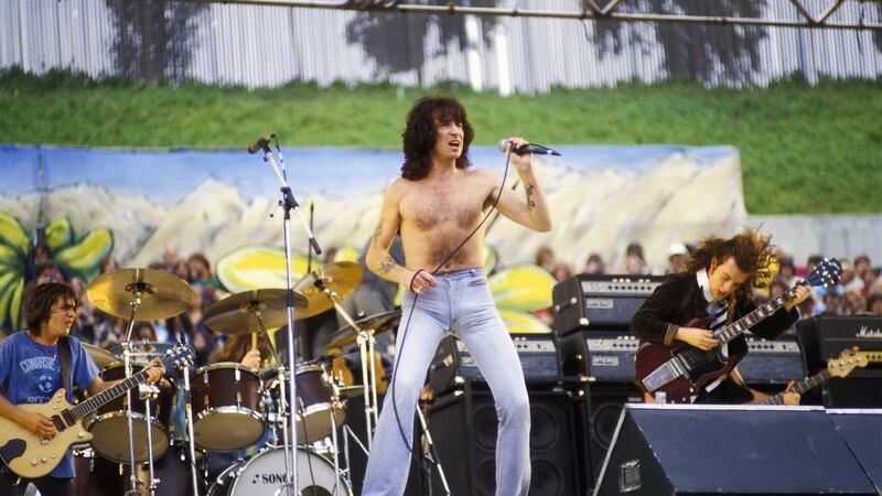 Malcolm Young, Bon Scott and Angus Young playing with AC/DC at Oakland Coliseum in Oakland, California IN 1979. Photograph: Larry Hulst/Michael Ochs Archives/Getty Images