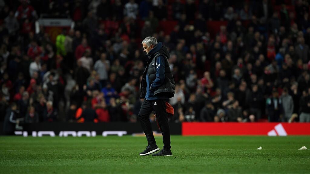 Manchester United manager José Mourinho leaves the Old Trafford pitch after their League Cup defeat to Derby County. Photo: Paul Ellis/Getty Images