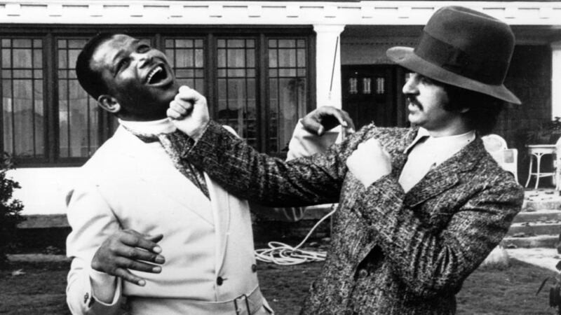 Ringo Starr tries his luck against Sugar Ray Robinson. Photograph: Keystone/Getty Images